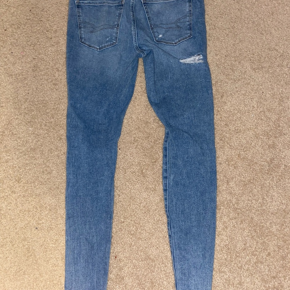 American eagle skinny jeans, size 8 long, light colored, distressed.